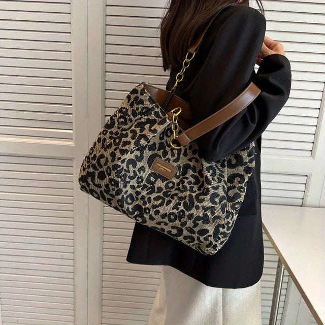 Rhea - Leopardprint håndveske med romslig interiør og dristig stil