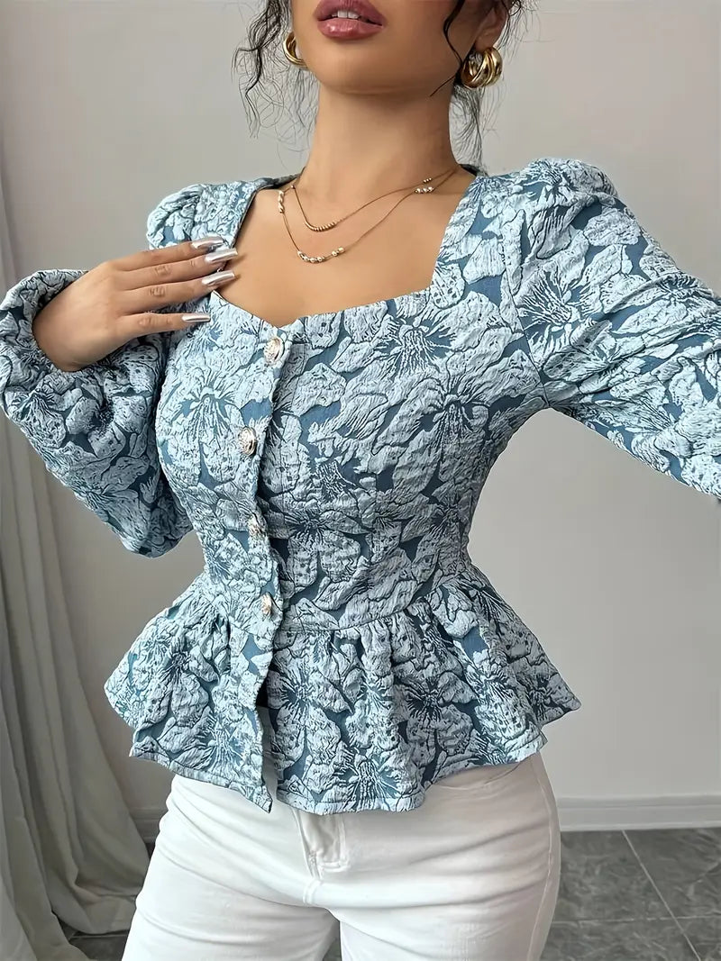 Stella - Elegant bluse med blomstermønster og puffede ermer