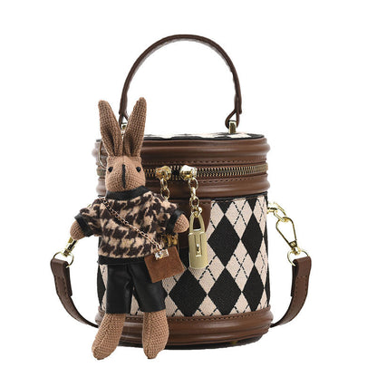 Charlotte - Rundformet håndveske med avtakbar stropp og kanin sjarm