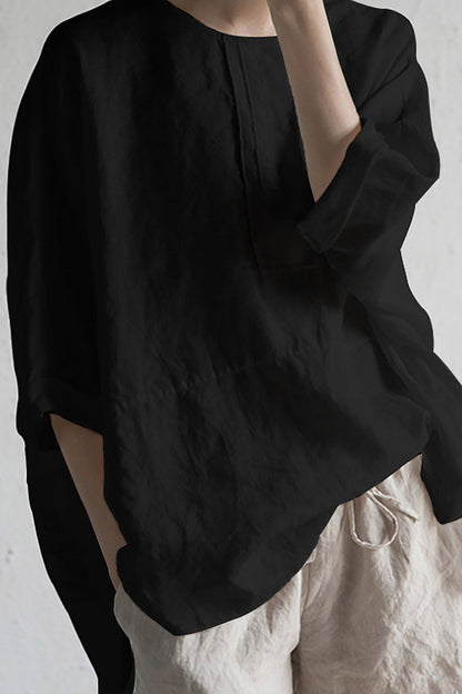 Elise – Oversized bluse med rund hals og oppbrettede ermer