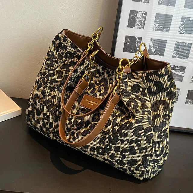 Rhea - Leopardprint håndveske med romslig interiør og dristig stil