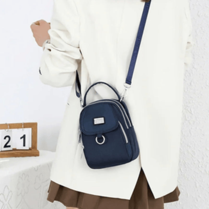 Amalia – Crossbody veske med justerbar stropp og hank