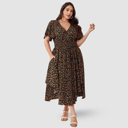 Astrid - Plus size maxikjole med blomstertrykk og lommer