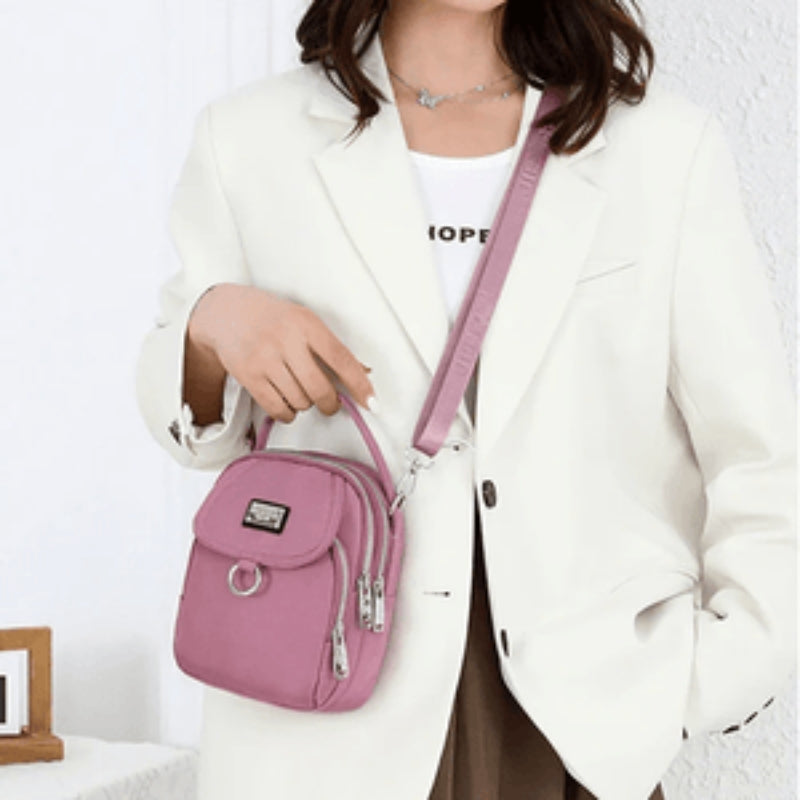Amalia – Crossbody veske med justerbar stropp og hank