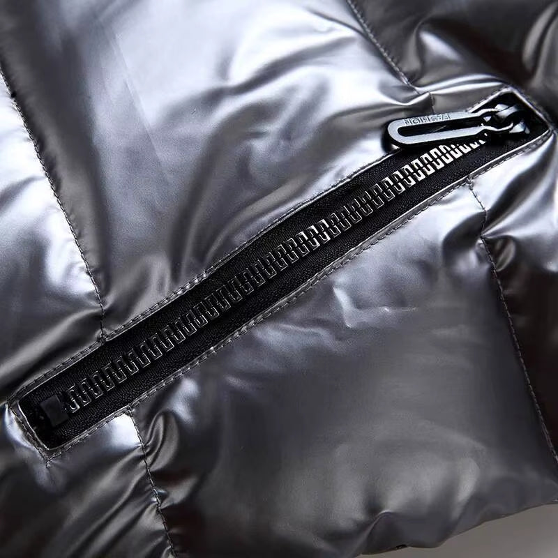 Manfred – Ermeløs polstret jakke med hette og glidelås