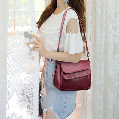 Elin – Skulderveske med justerbare stropper og glidelåslommer