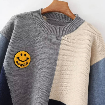Mariana - Genser i fargeblokk med smiley-lapp og distressed detaljer