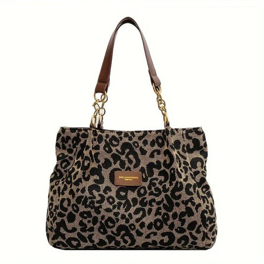 Rhea - Leopardprint håndveske med romslig interiør og dristig stil