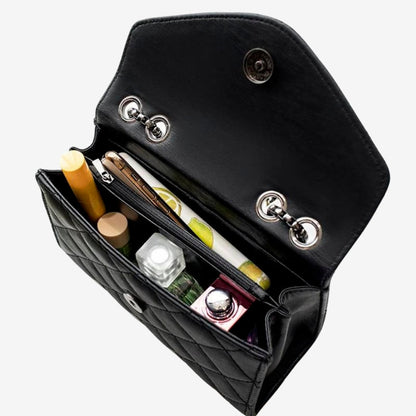 Ariane – Quiltet skulderveske med dusker og stor kapasitet