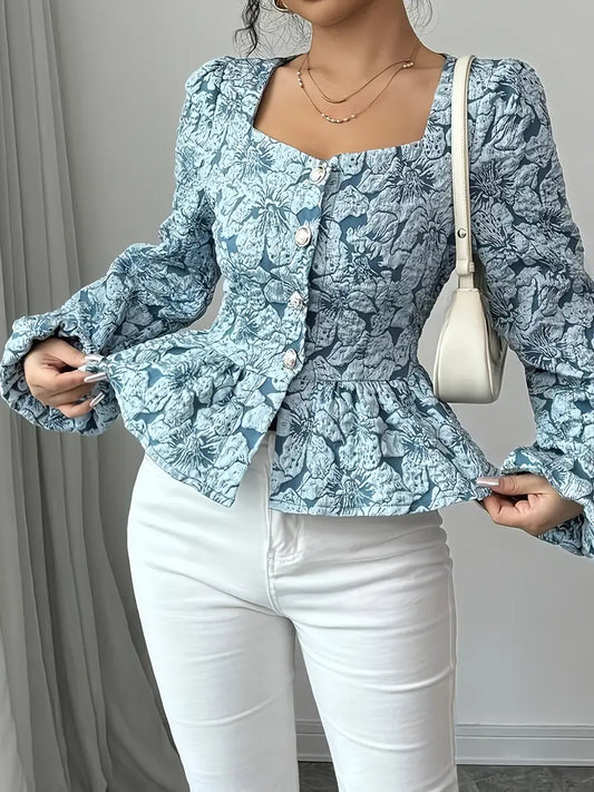 Stella - Elegant bluse med blomstermønster og puffede ermer