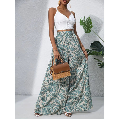 Matilda – Elegant bukse med vidde ben med høy midje og delikat blomstermønster overalt