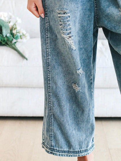 Freya - Ermeløs jumpsuit i denim med vide ben