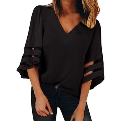 Liva – Avslappet kortermet bluse med V-hals og myk, flytende silhuett