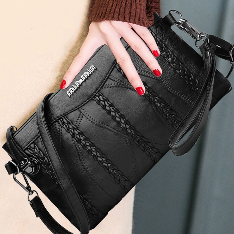 Nora - Sleek crossbody veske med justerbar stropp og flettede aksenter