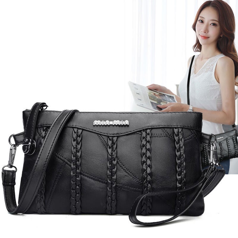 Nora - Sleek crossbody veske med justerbar stropp og flettede aksenter