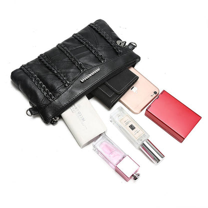 Nora - Sleek crossbody veske med justerbar stropp og flettede aksenter