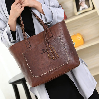 Sophie - Stilig skulderveske med flettede håndtak