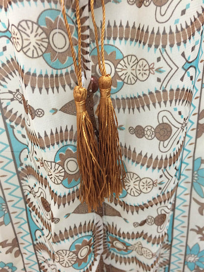 Isabella - Flytende maxikjole med detaljert mønster og rynket midje