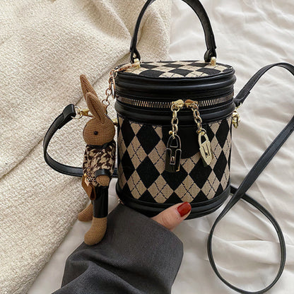 Charlotte - Rundformet håndveske med avtakbar stropp og kanin sjarm