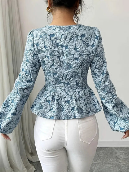 Stella - Elegant bluse med blomstermønster og puffede ermer