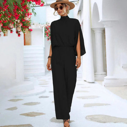 Stella - Jumpsuit med ermer i Cape-stil med åpen ryggdesign