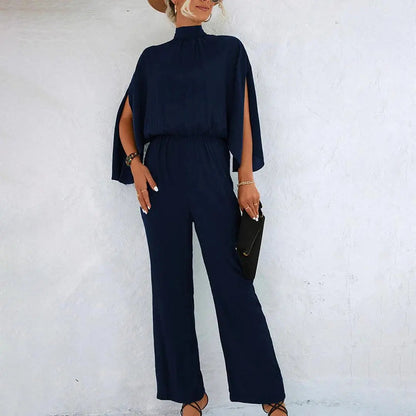 Stella - Jumpsuit med ermer i Cape-stil med åpen ryggdesign