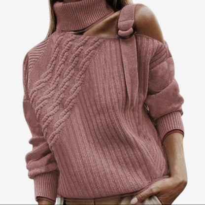 Pink cable knit sweater worn by a person on a white background