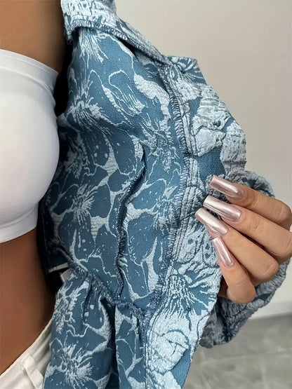 Stella - Elegant bluse med blomstermønster og puffede ermer