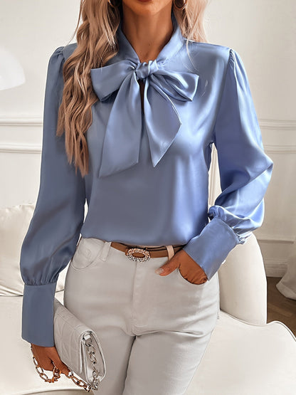 Abigail - Chic bluse med overdimensjonert sløyfe og trendy puffermer