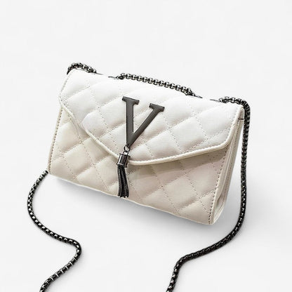 Ariane – Quiltet skulderveske med dusker og stor kapasitet