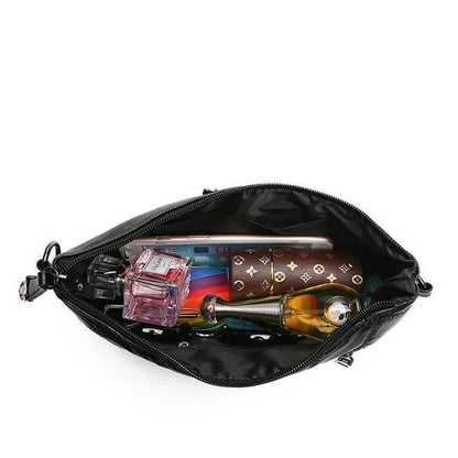 Nora - Sleek crossbody veske med justerbar stropp og flettede aksenter